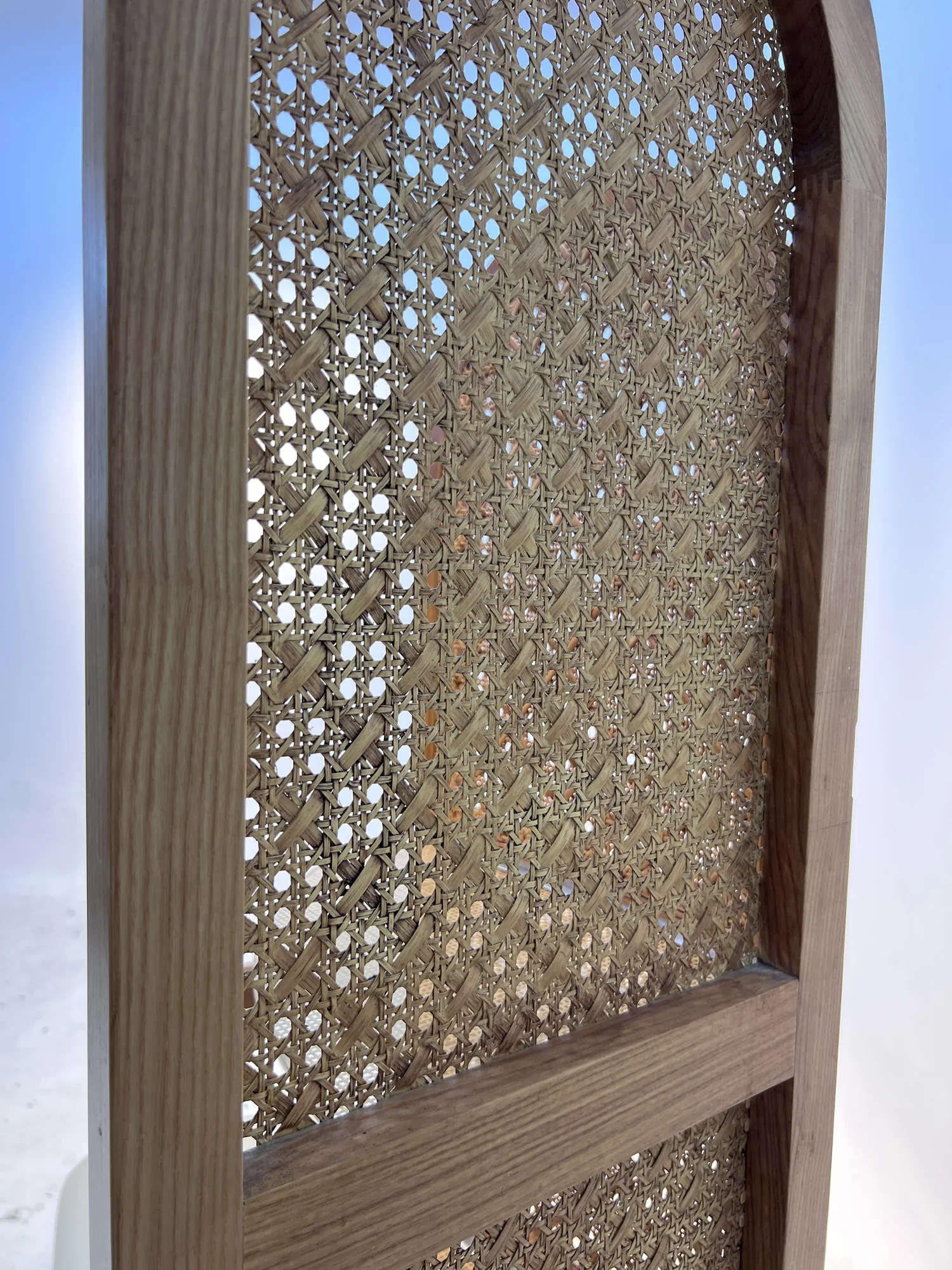 Carved lattice panel checked for density and finish
