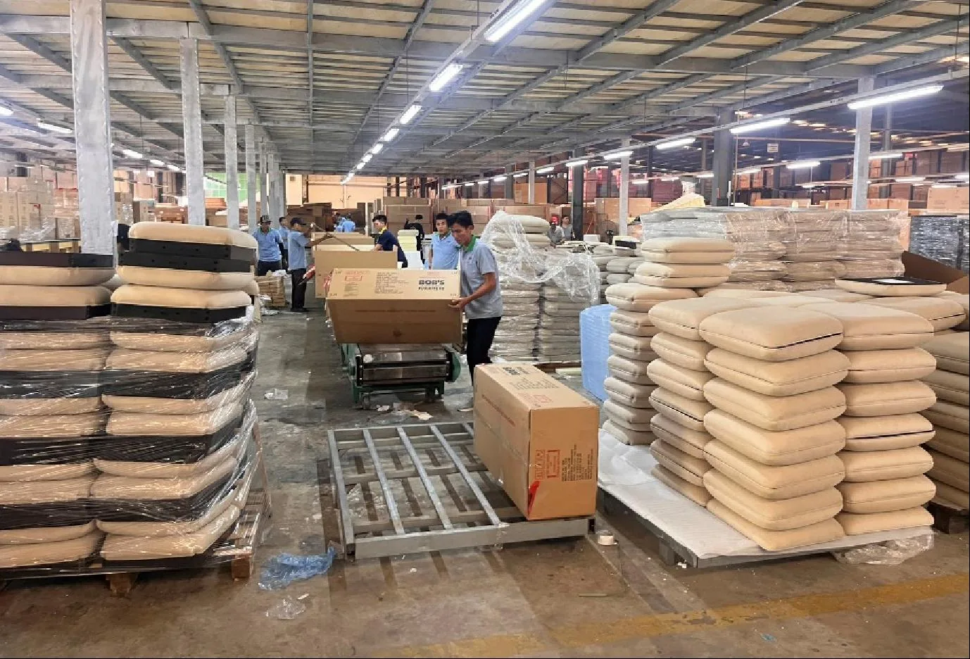 Export cartons and packed furniture stacked on pallets ready for loading