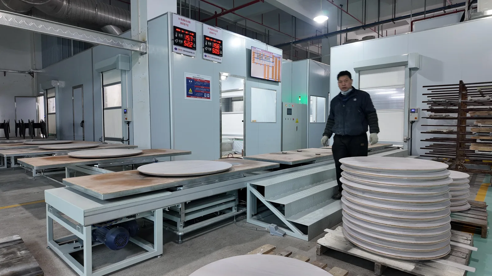 Sanding and finishing line in a Foshan casegoods factory