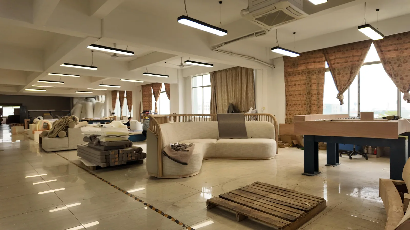 Upholstered lounge seating lined up in the factory showroom