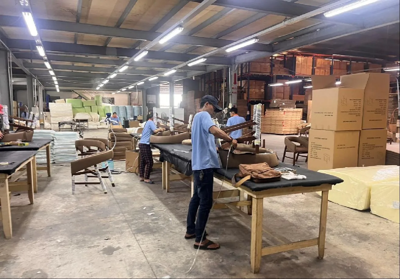 Carpenters at a factory workbench