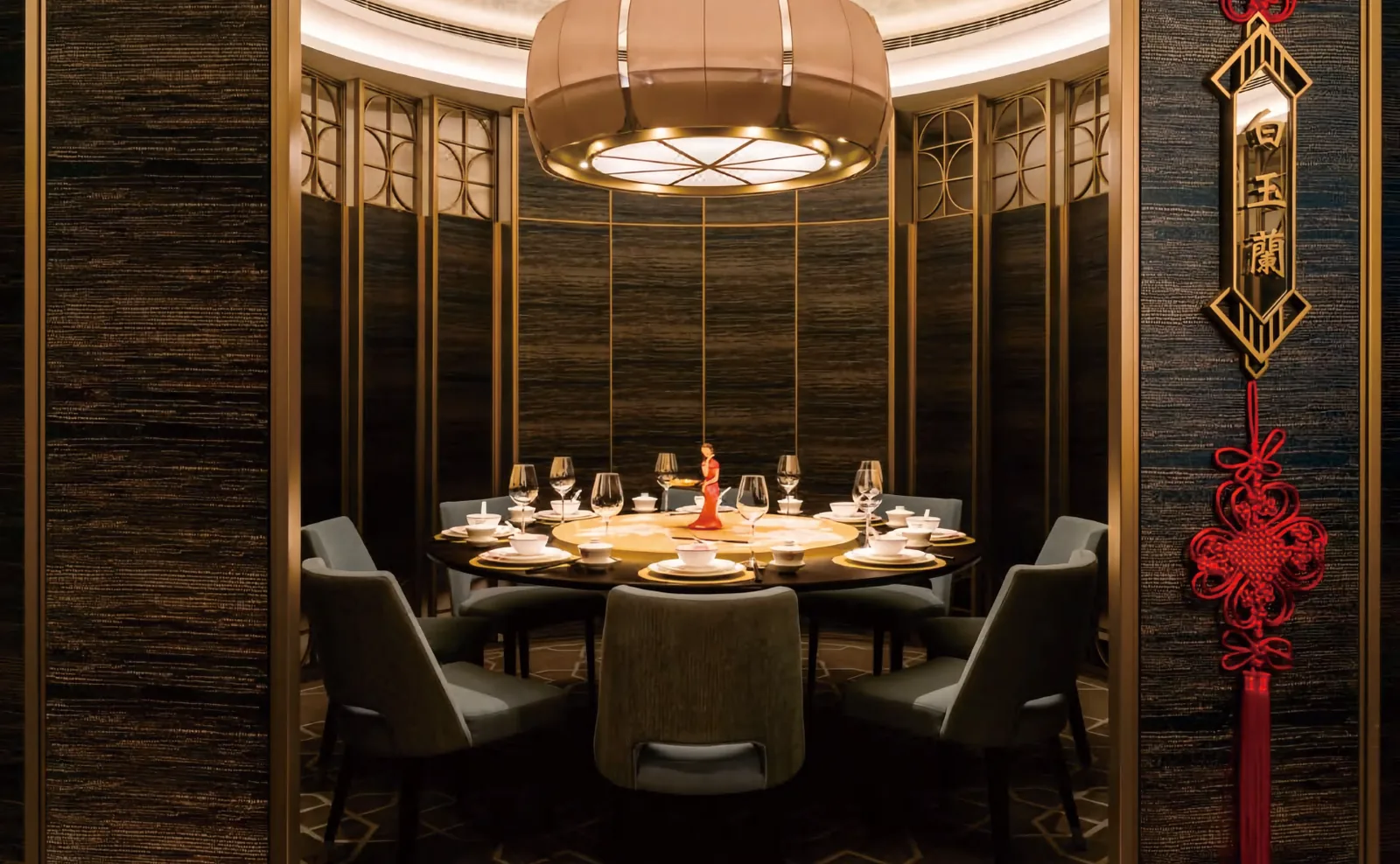 Private dining room with round table and upholstered chairs