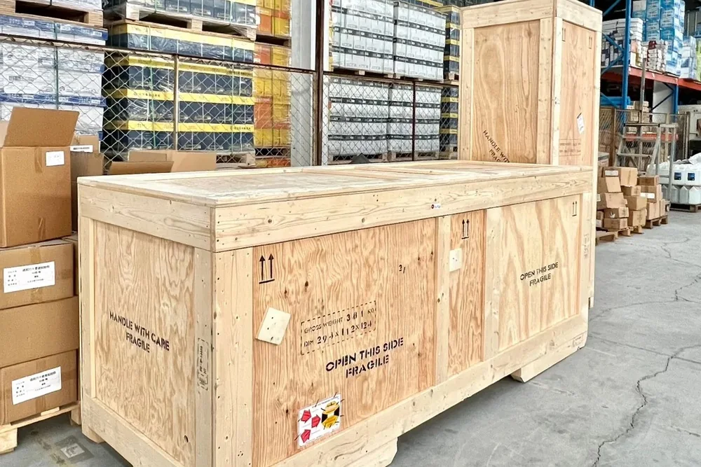 Crated furniture from several factories collected together at the Source Foshan consolidation warehouse