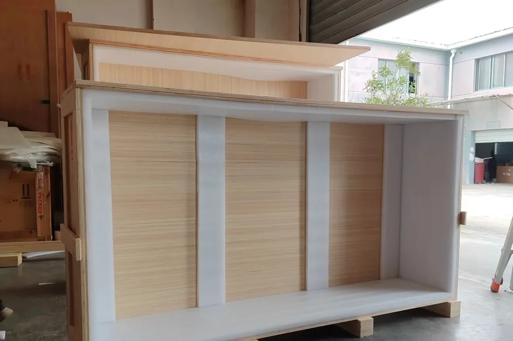 A cabinet braced inside a timber crate at the Foshan warehouse before export