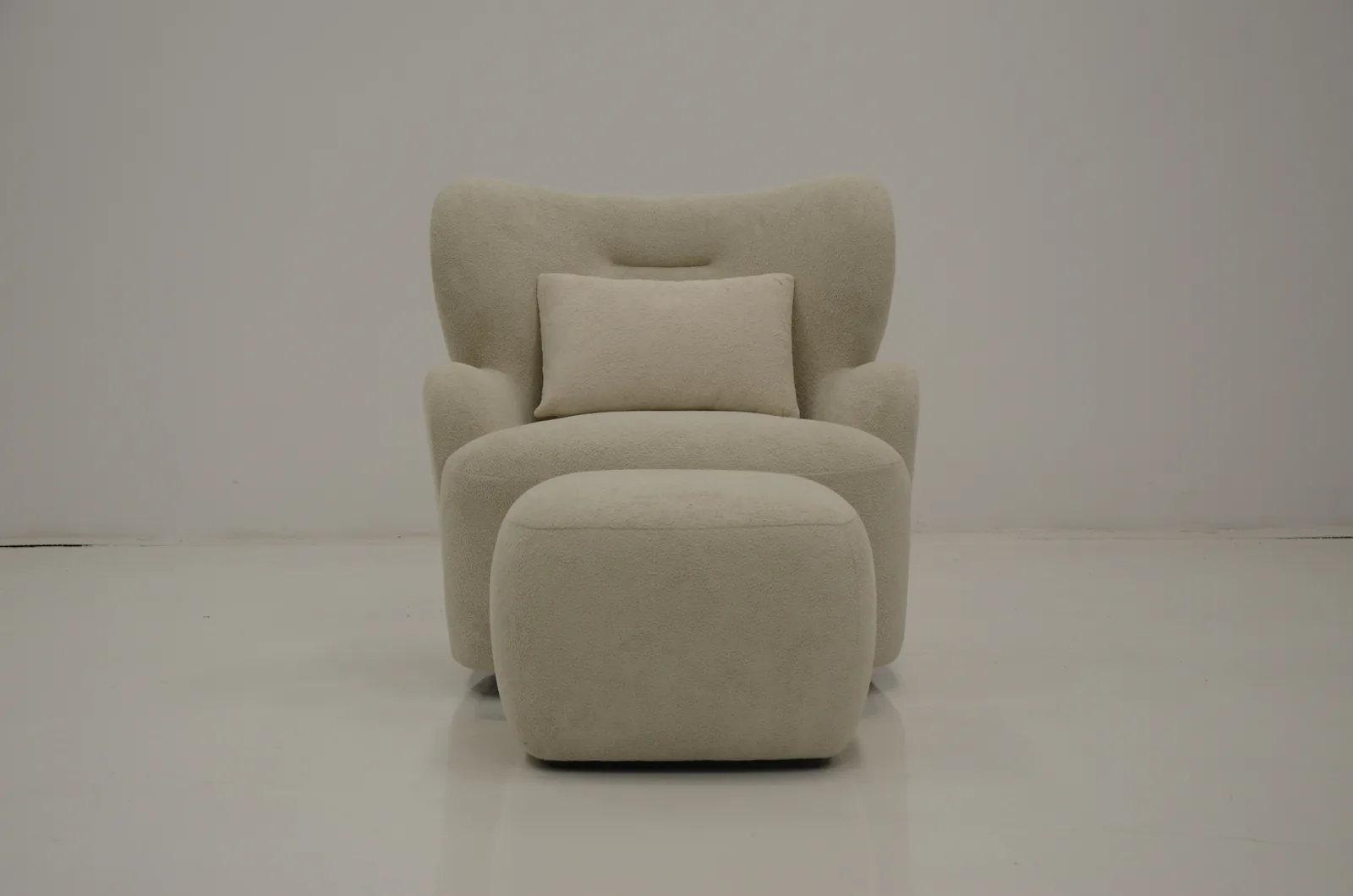 Cream boucle armchair with matching ottoman