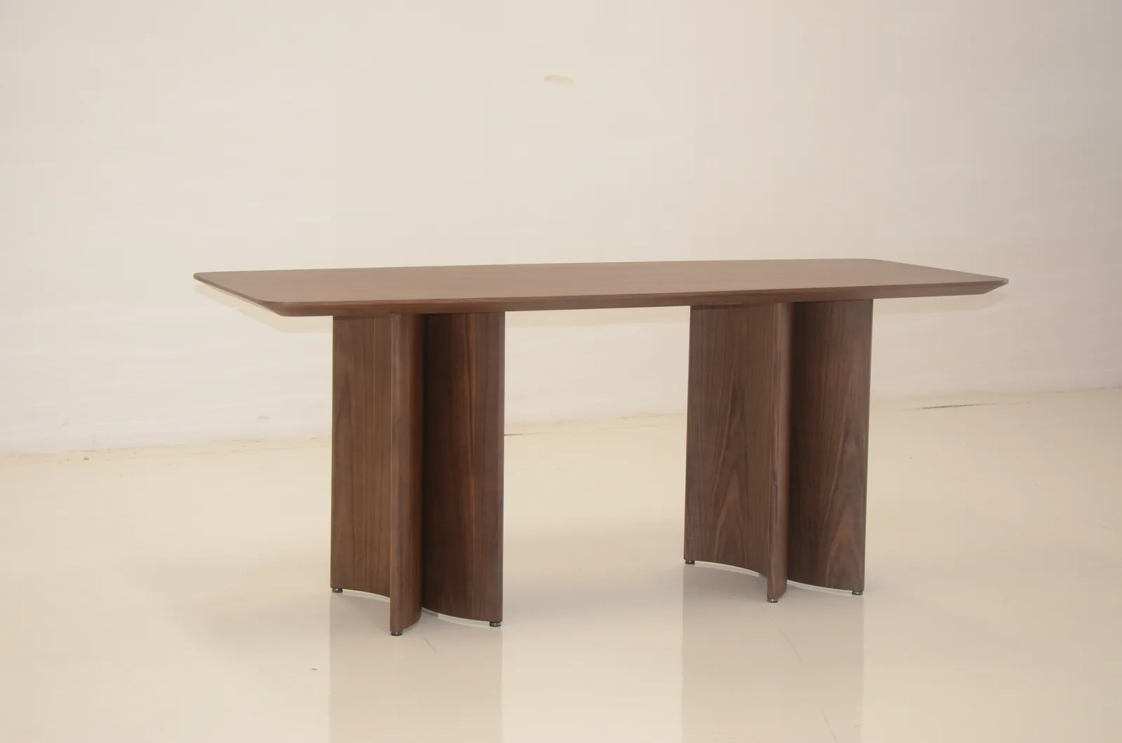 Walnut dining table with sculptural legs