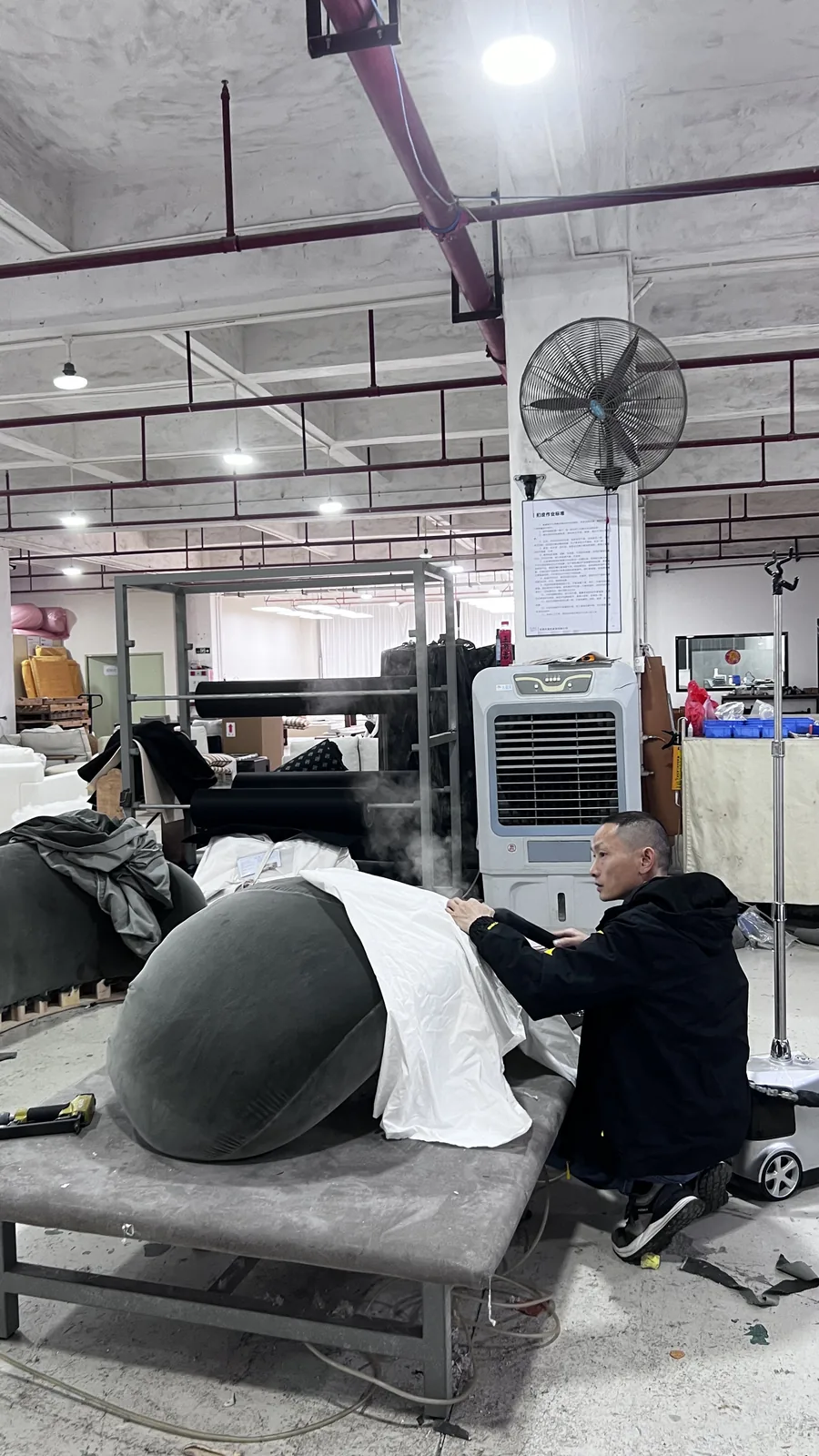 Sofa production line in a Foshan factory with frames waiting for upholstery