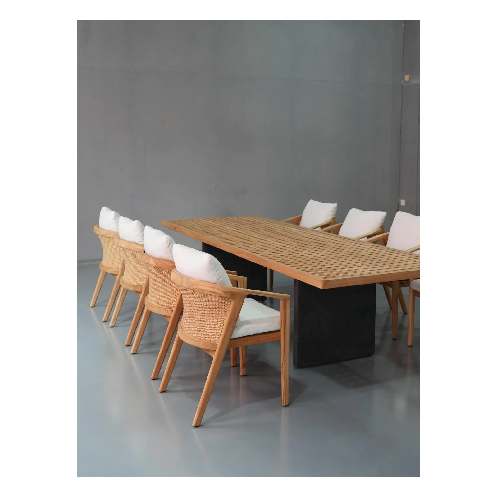 Teak outdoor dining table with rope-back chairs photographed at a Foshan outdoor furniture factory