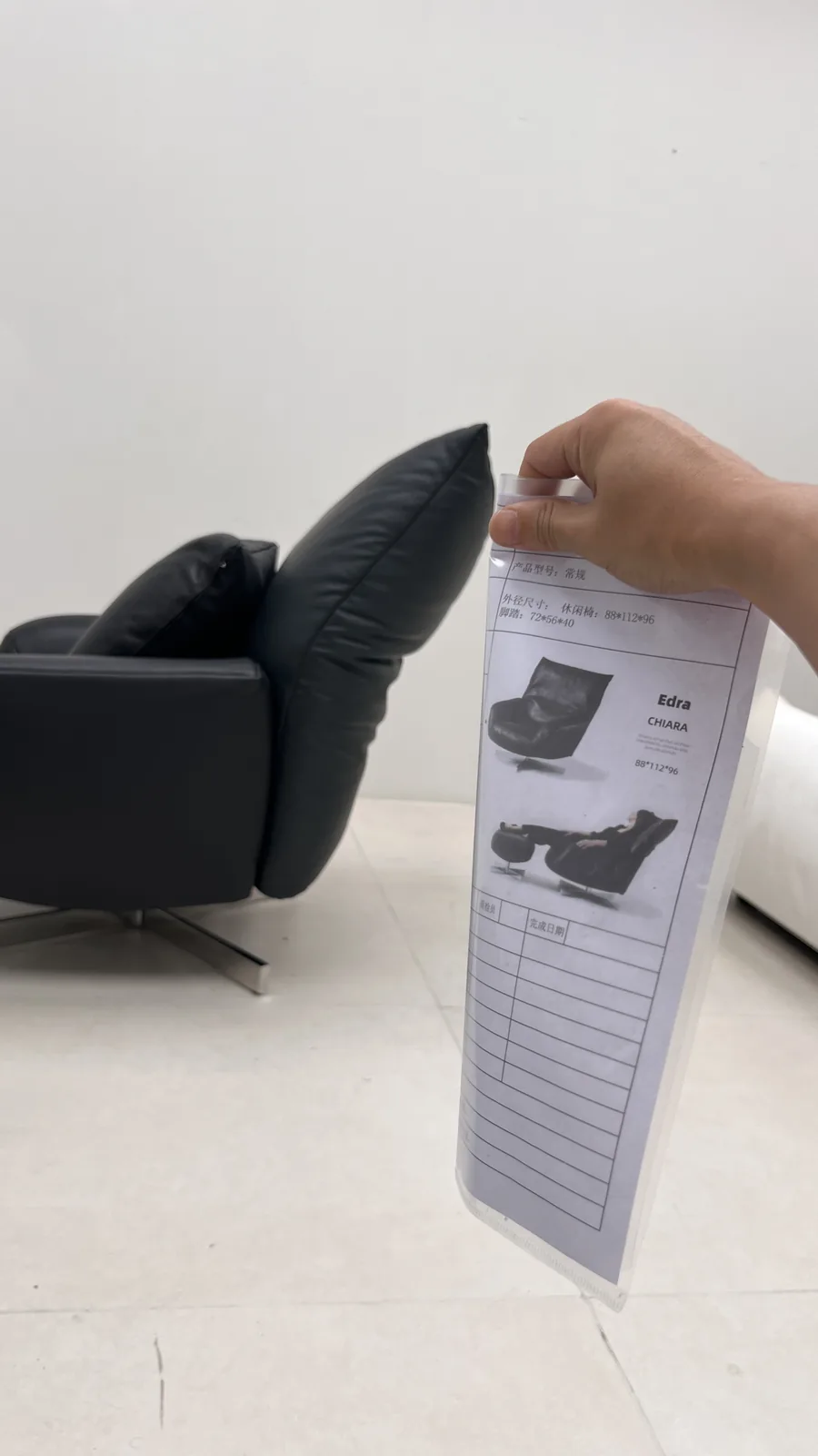 Inspector checking a sofa against its spec sheet; beds get the same item-by-item check