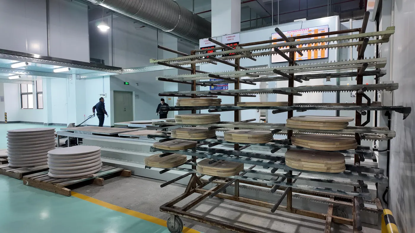 Tabletops drying on finishing racks