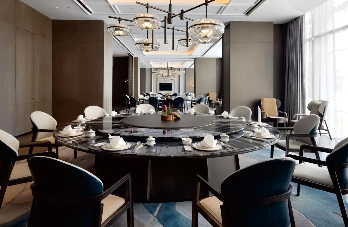 Hotel private dining room with round table and armchairs