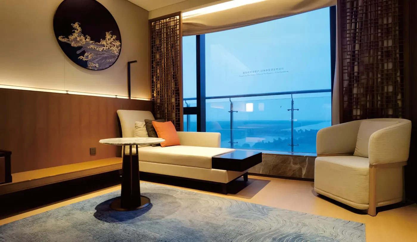 Hotel suite reading corner with chaise and lounge chair