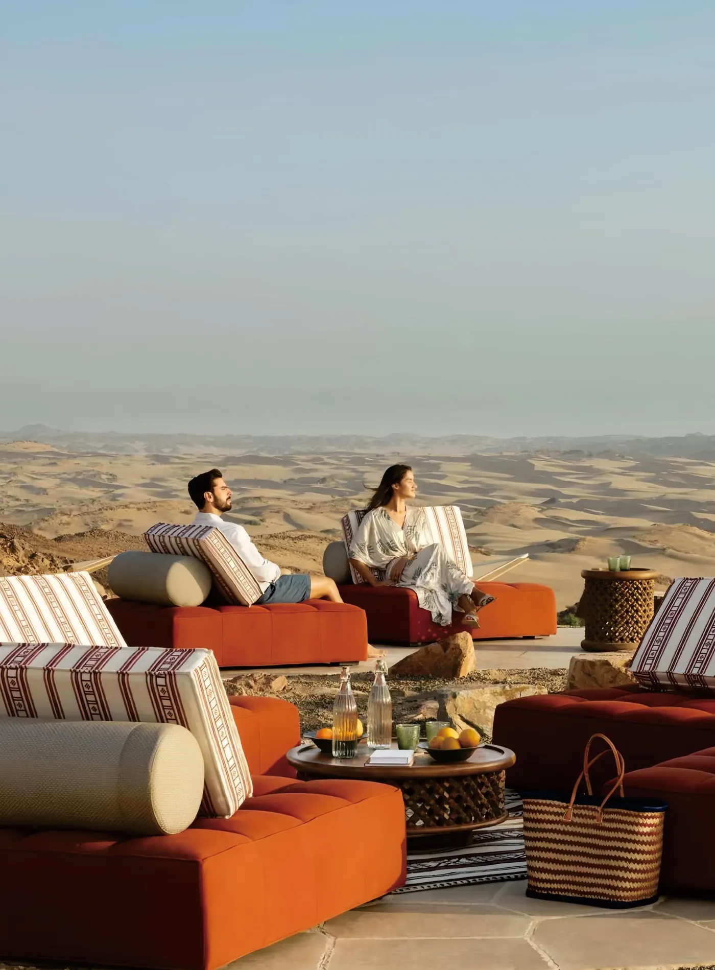 Guests on outdoor sofas at a desert resort