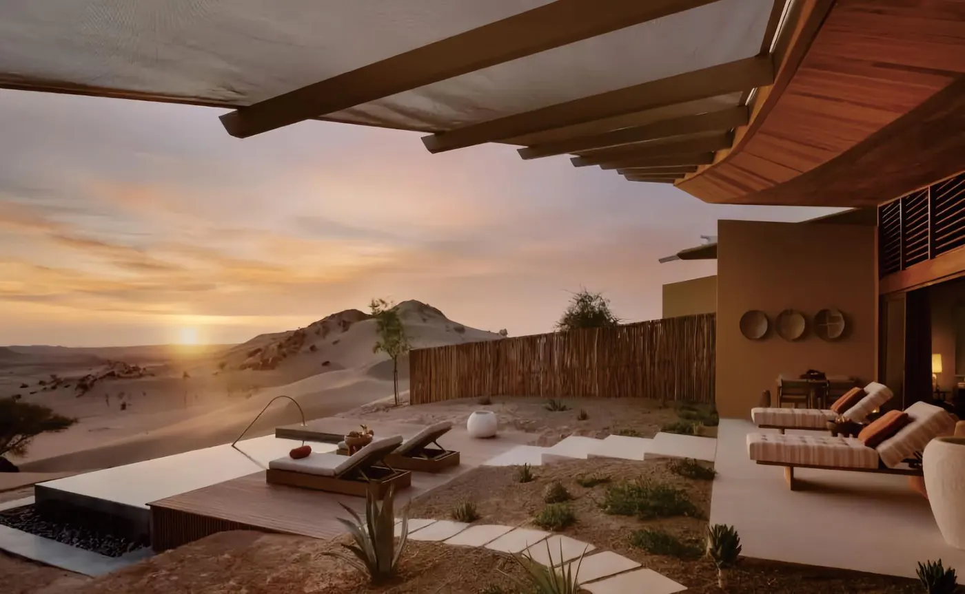 Desert resort shaded terrace with daybeds and loungers
