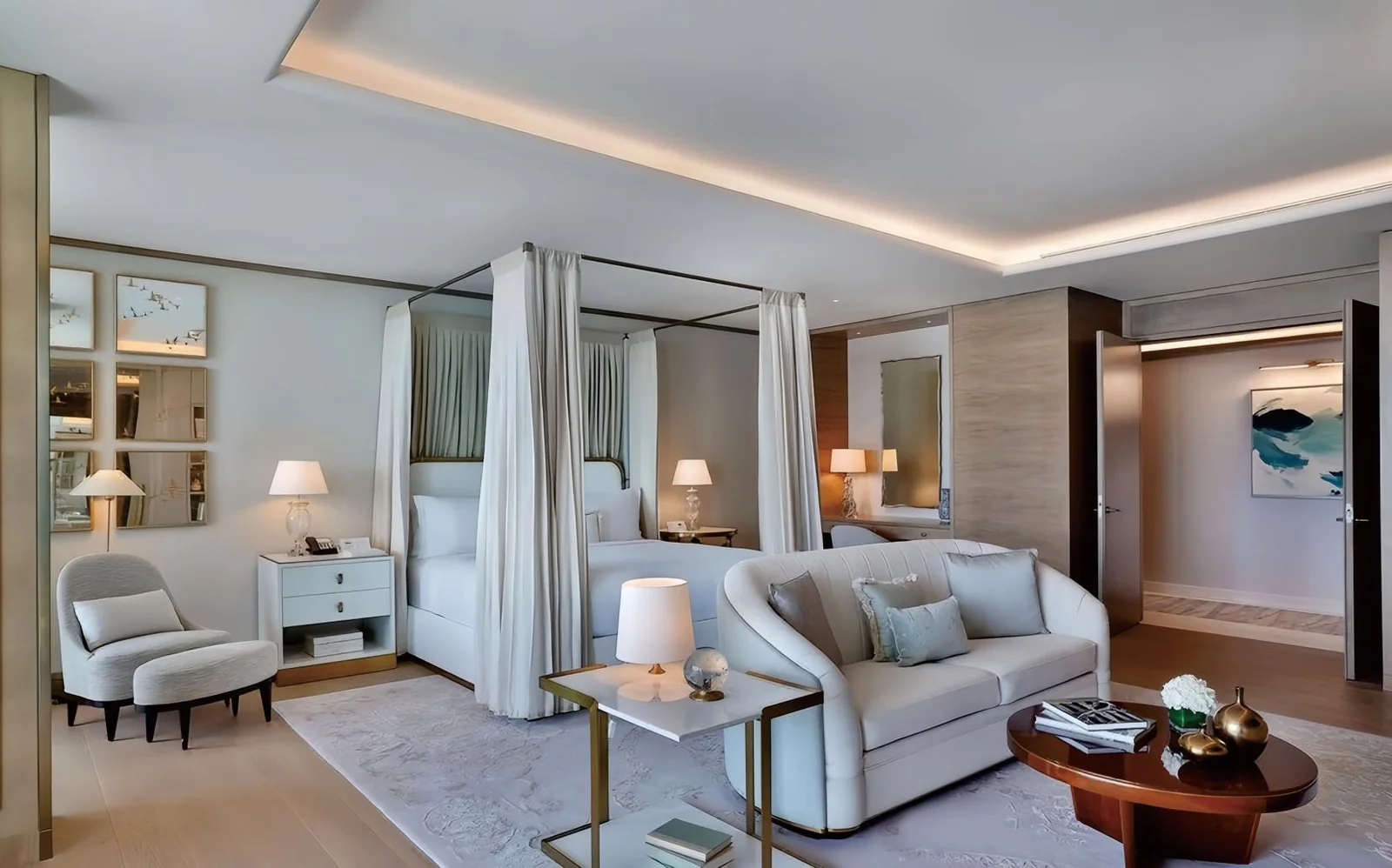 Hotel guestroom with floral art headboard and yellow lounge seating