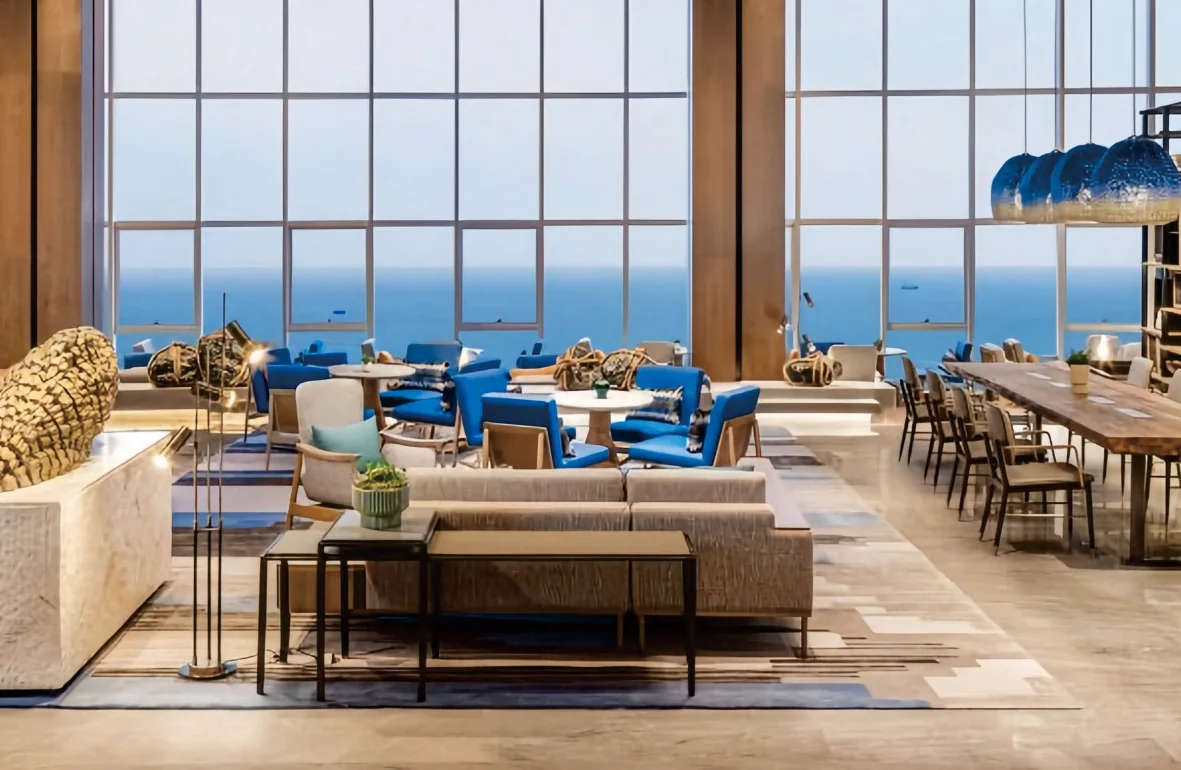Hotel lounge with blue glass pendants and lounge seating