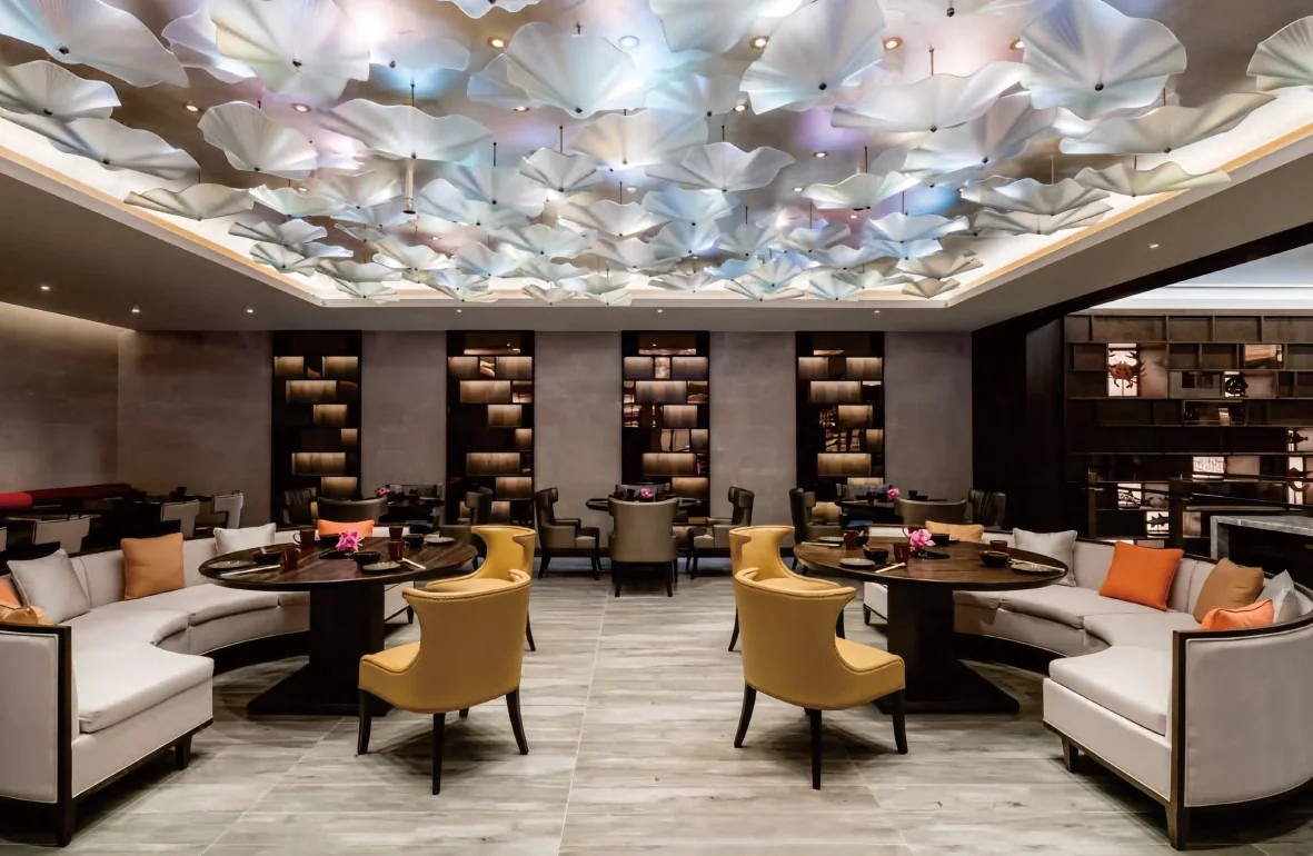 Hotel all-day restaurant with timber chairs and banquettes
