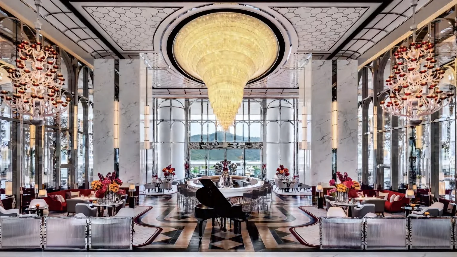 Hotel suite with cream sofa, armchairs and marble table produced by a Foshan hospitality factory