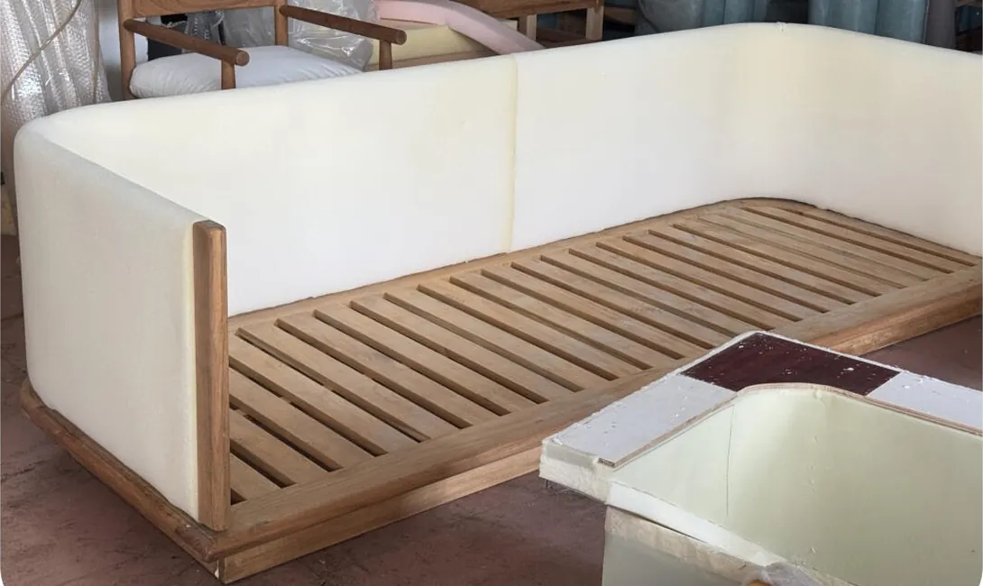 Outdoor sofa frame with foam blocks fitted on the factory floor before upholstery