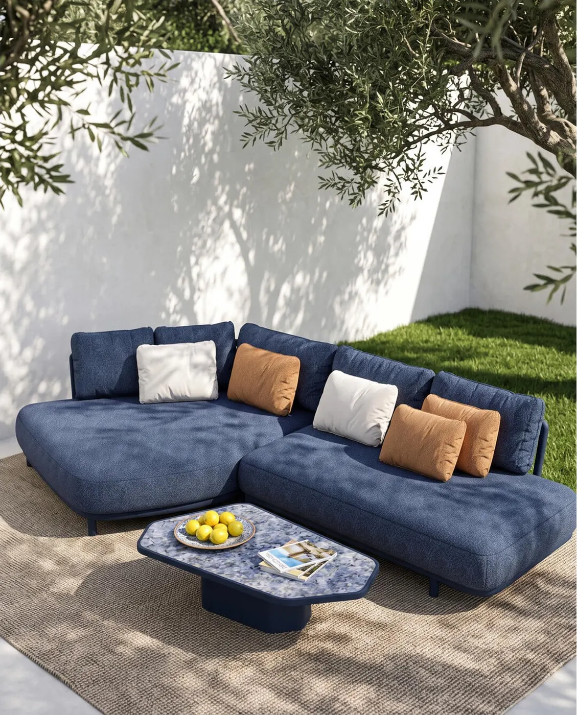 Navy modular outdoor sectional with stone coffee table in a walled garden