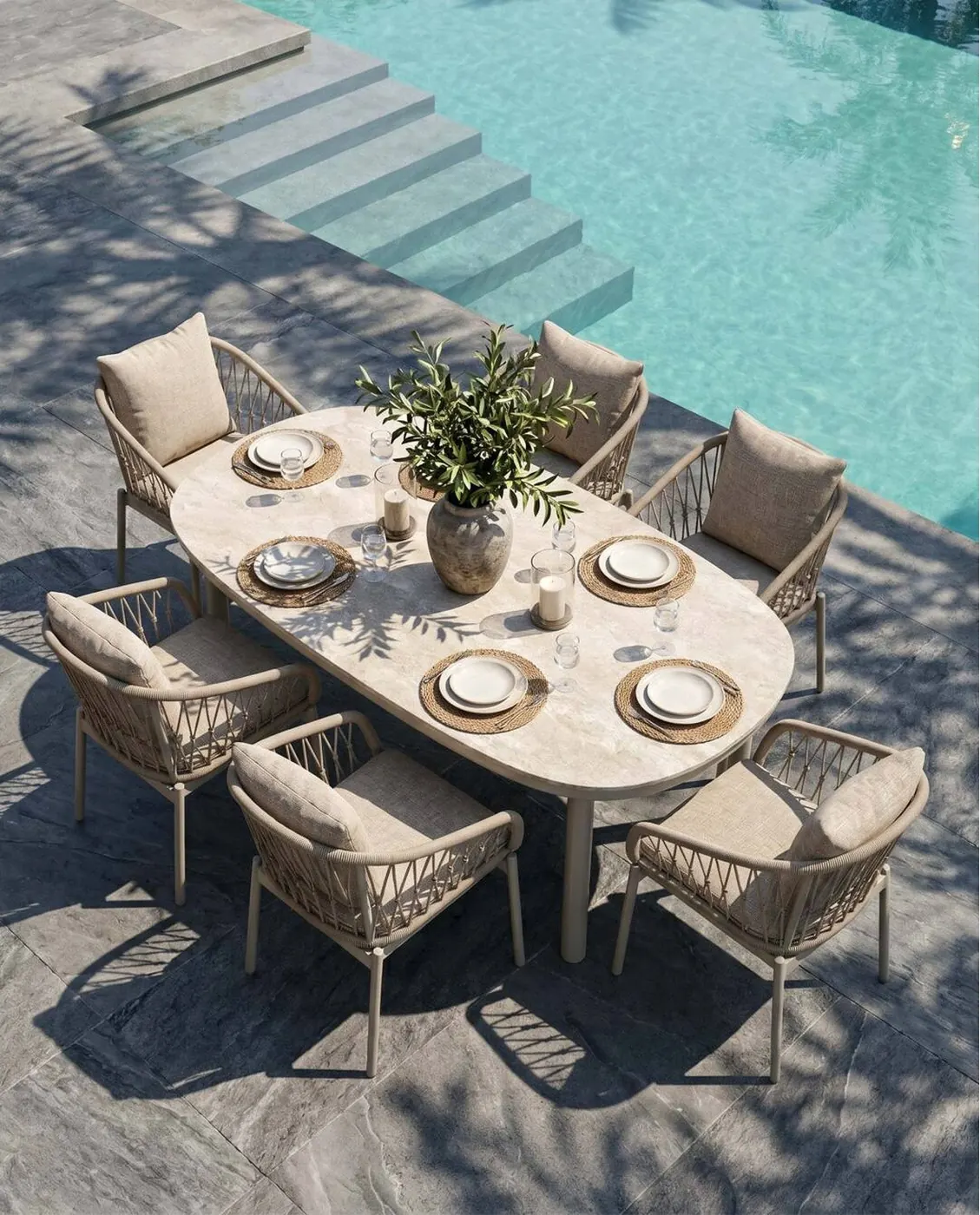 Rope-weave outdoor dining set with powder-coated aluminium frames beside a pool