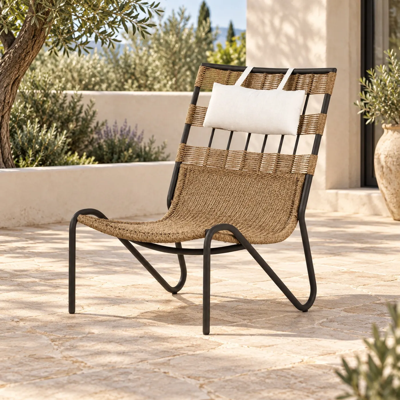 Woven sling lounge chair with a steel frame on a terrace