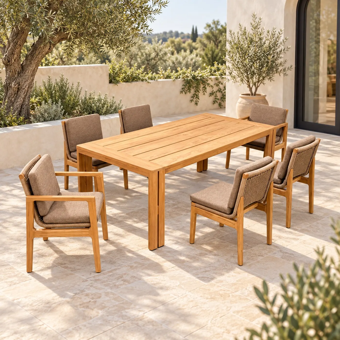 Teak outdoor dining set with taupe upholstered chairs on a villa terrace