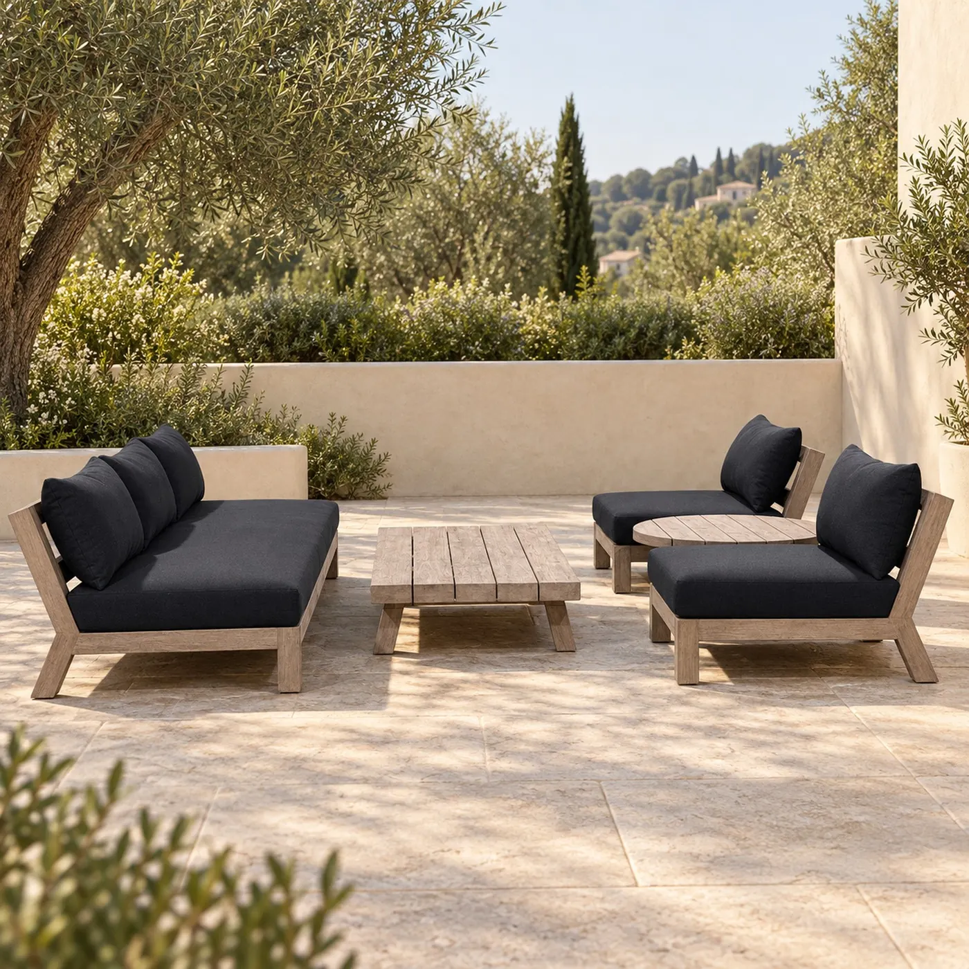 Modular teak outdoor lounge set with charcoal cushions on a terrace