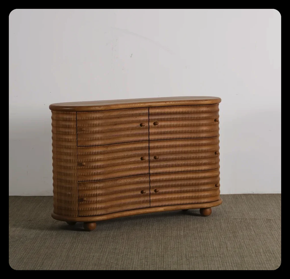 Curved reeded oak dresser with two doors on ball feet