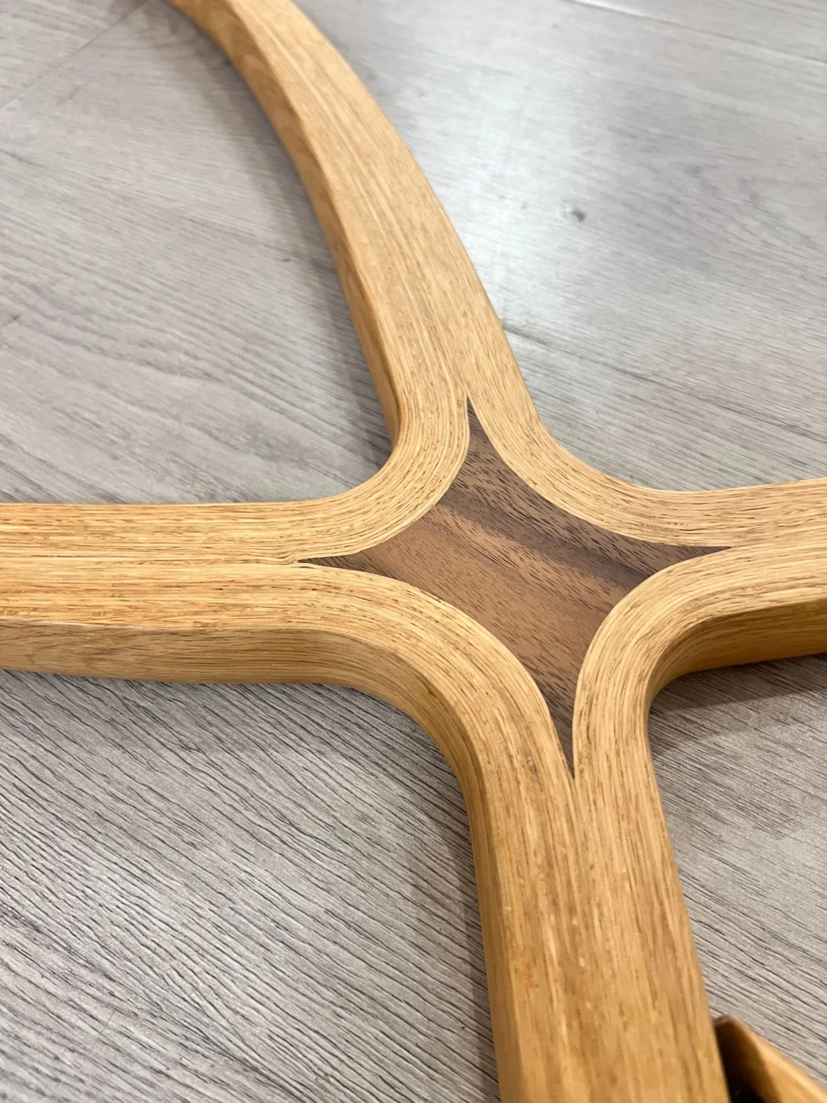 Bent oak base joint checked for a flush fit