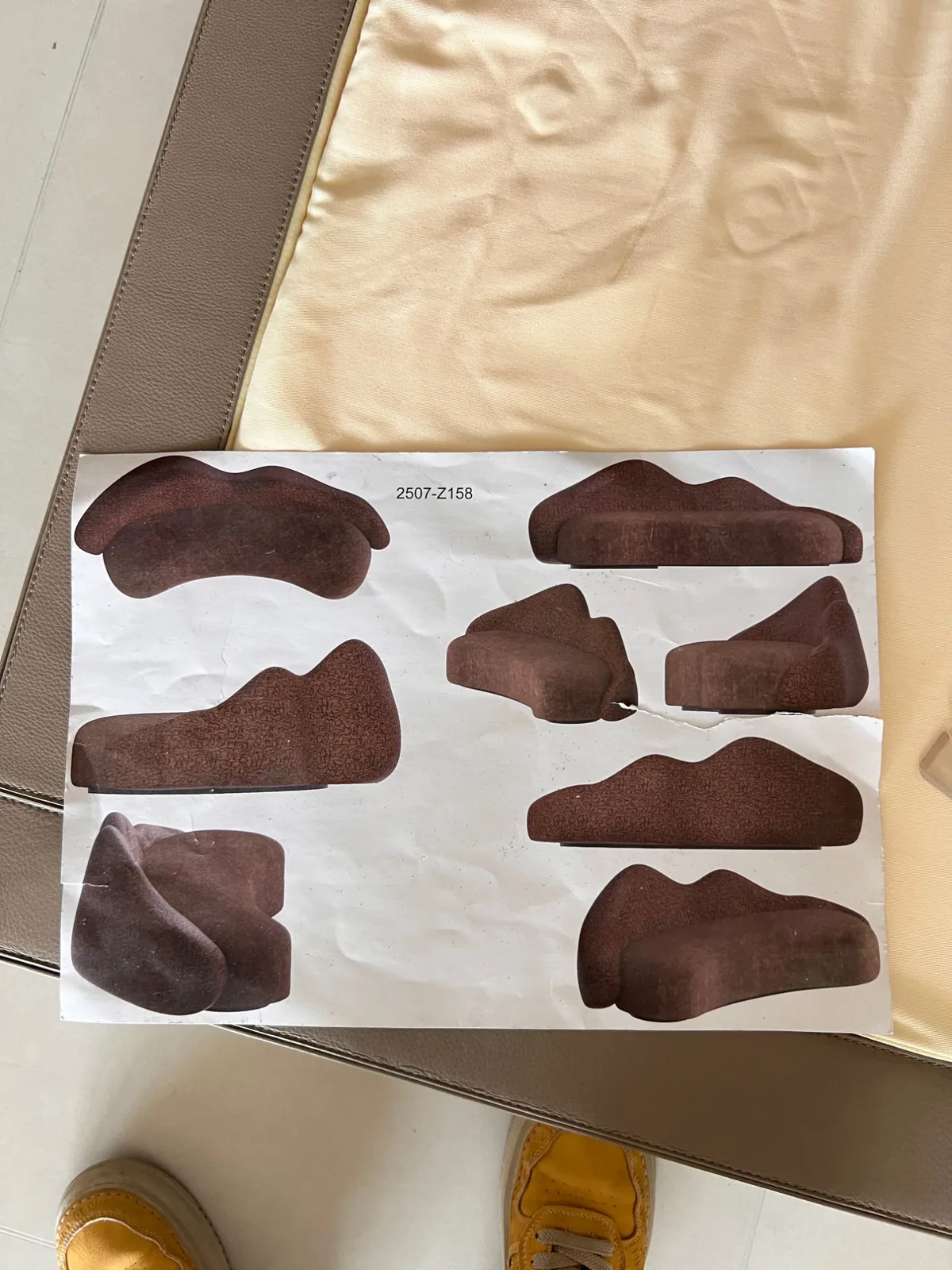 Printed design sheet 2507-Z158 with six views of a sculptural sofa laid on the finished piece