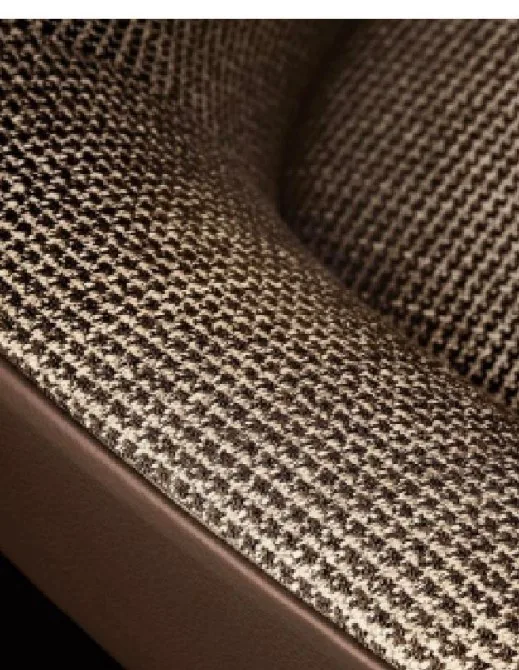 Close-up of upholstery fabric weave being checked during inspection