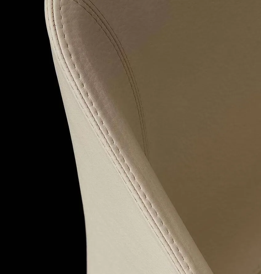 Close-up of leather grain and stitching under inspection