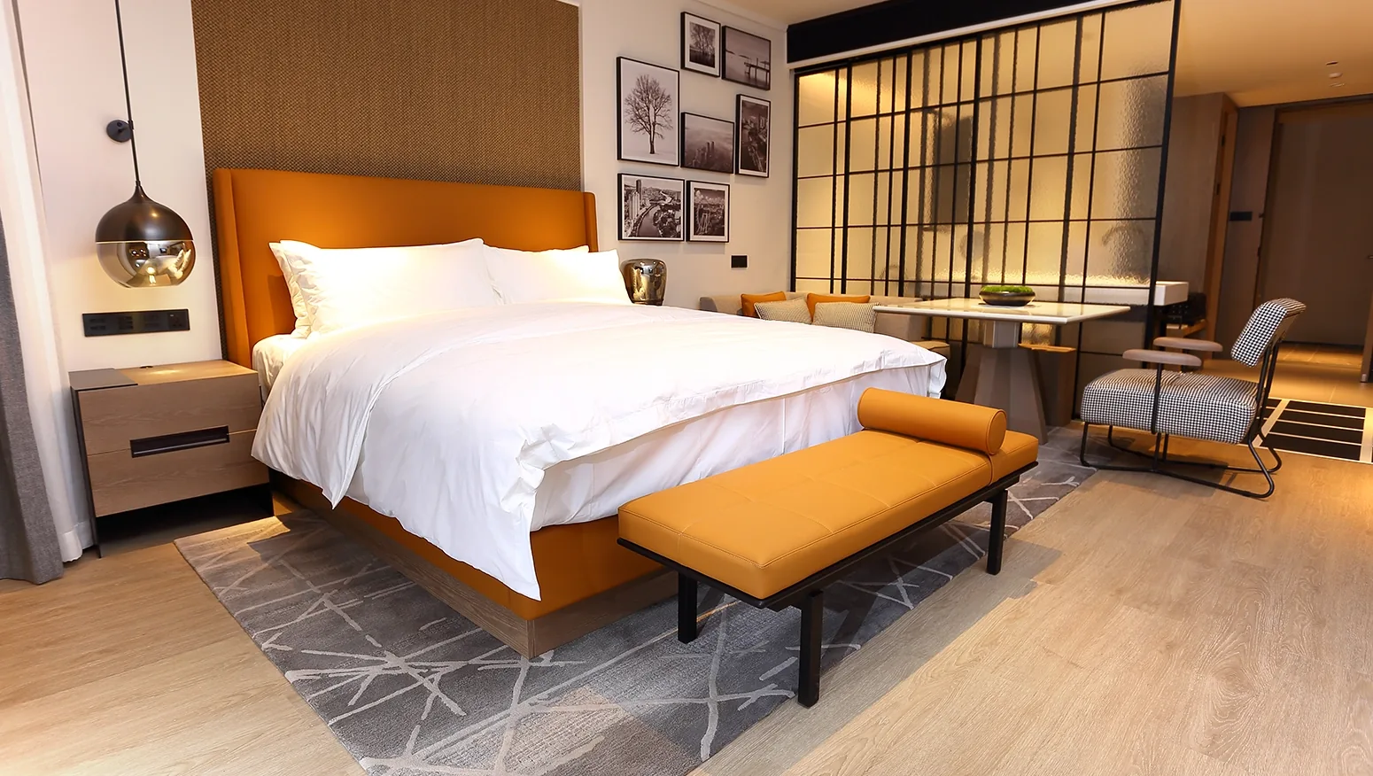 Hotel guest room furnished with casegoods and seating shipped in phases