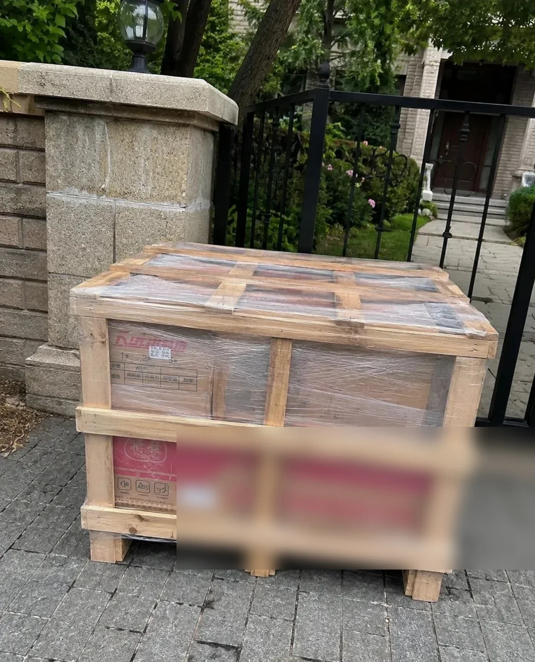 A large table crated in a custom timber frame standing on a driveway in Canada