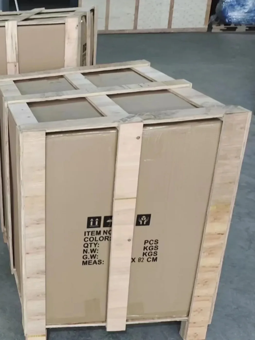 A framed furniture carton printed with an export marking template listing item number, quantity, net and gross weight and measurements