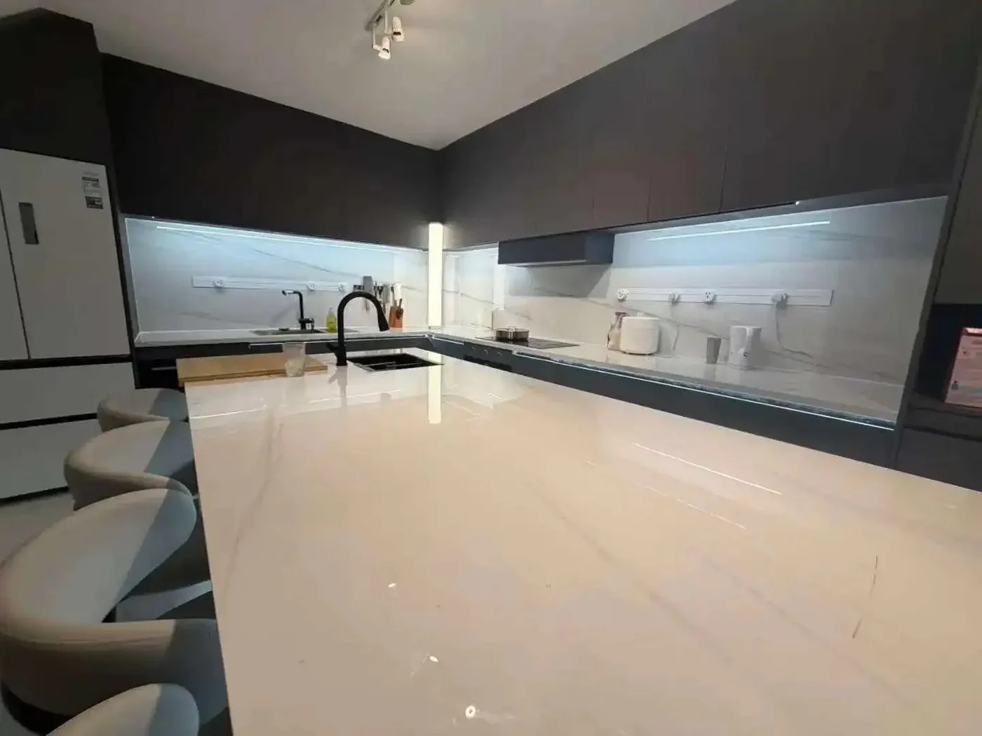 A custom aluminium kitchen with a sintered-stone island imported from China and installed in Dublin