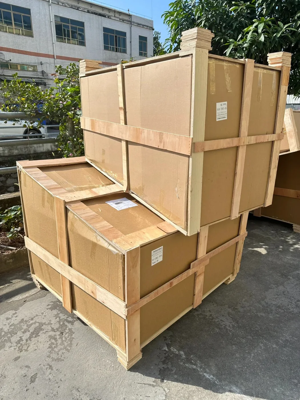 Two cartons in timber-slat crates with plywood corner blocks and stencilled shipping marks
