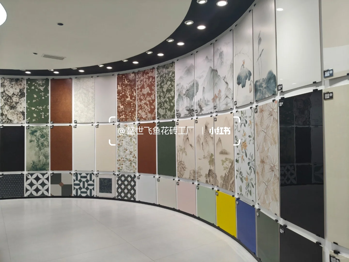 Curved showroom display of floral, landscape and geometric decorative tile panels.