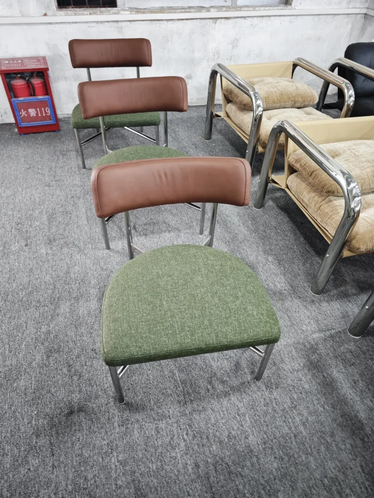 Buyer comparing upholstered sofas in a Foshan furniture showroom