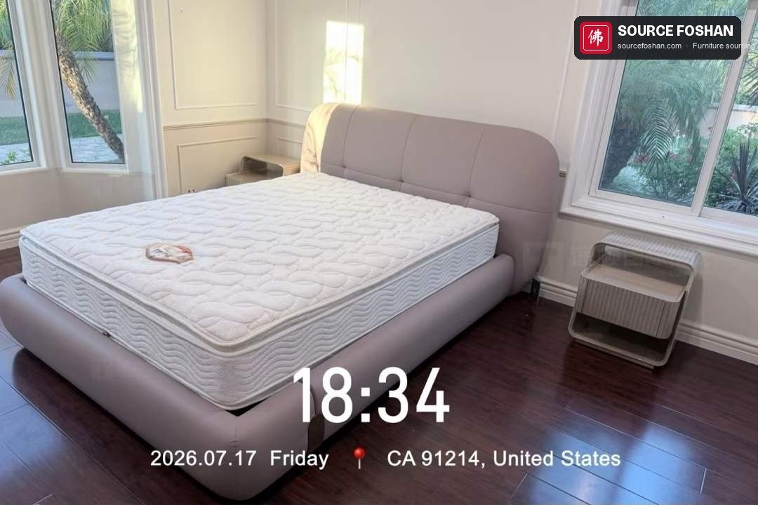 Bed and mattress installed in a bedroom