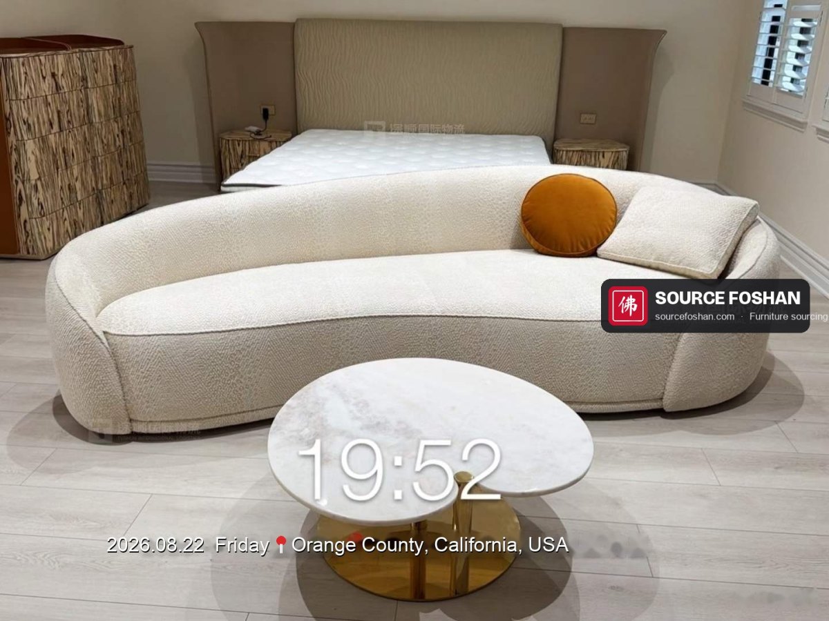 Curved boucle sofa and marble side table from Foshan in a California bedroom