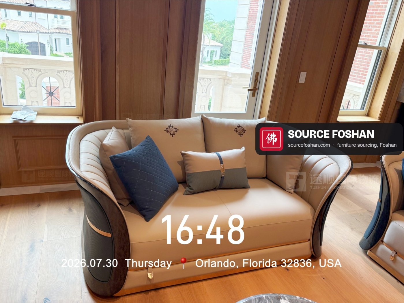 Curved sofa with cushions, 16:48