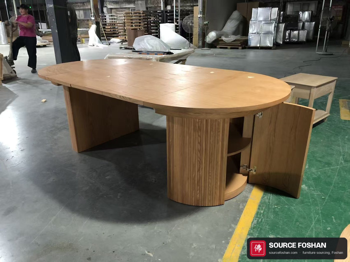 Fluted pedestal base with the door open, showing the internal shelf and hinge alignment