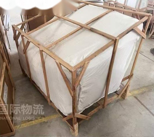 Timber-braced crate around a wrapped sofa