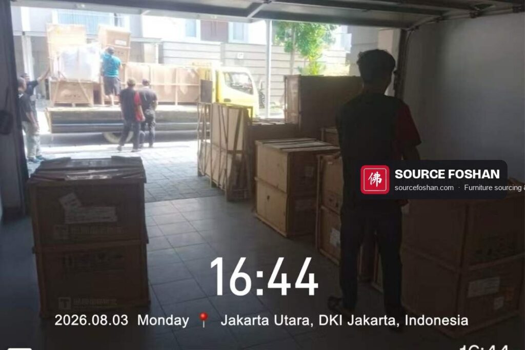 Crates from Foshan carried into a garage on delivery day