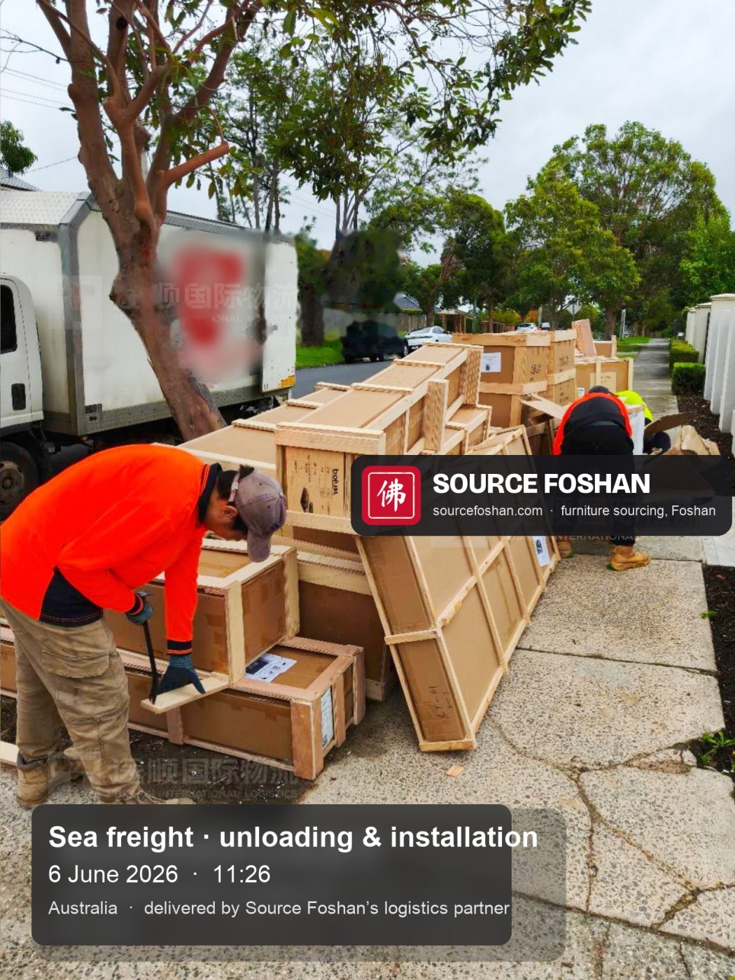 Timber crates from Foshan lined up on the driveway beside the truck, 11:26