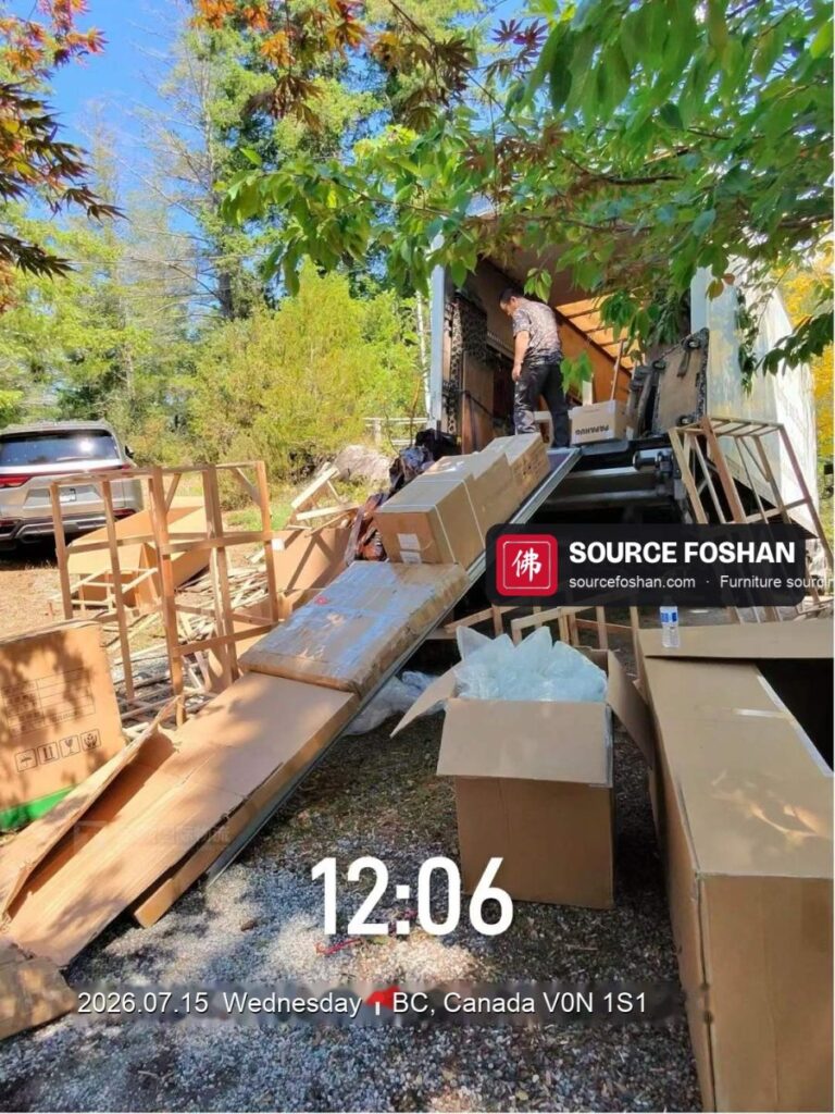 Delivery truck unloading crated Foshan furniture at a home in British Columbia