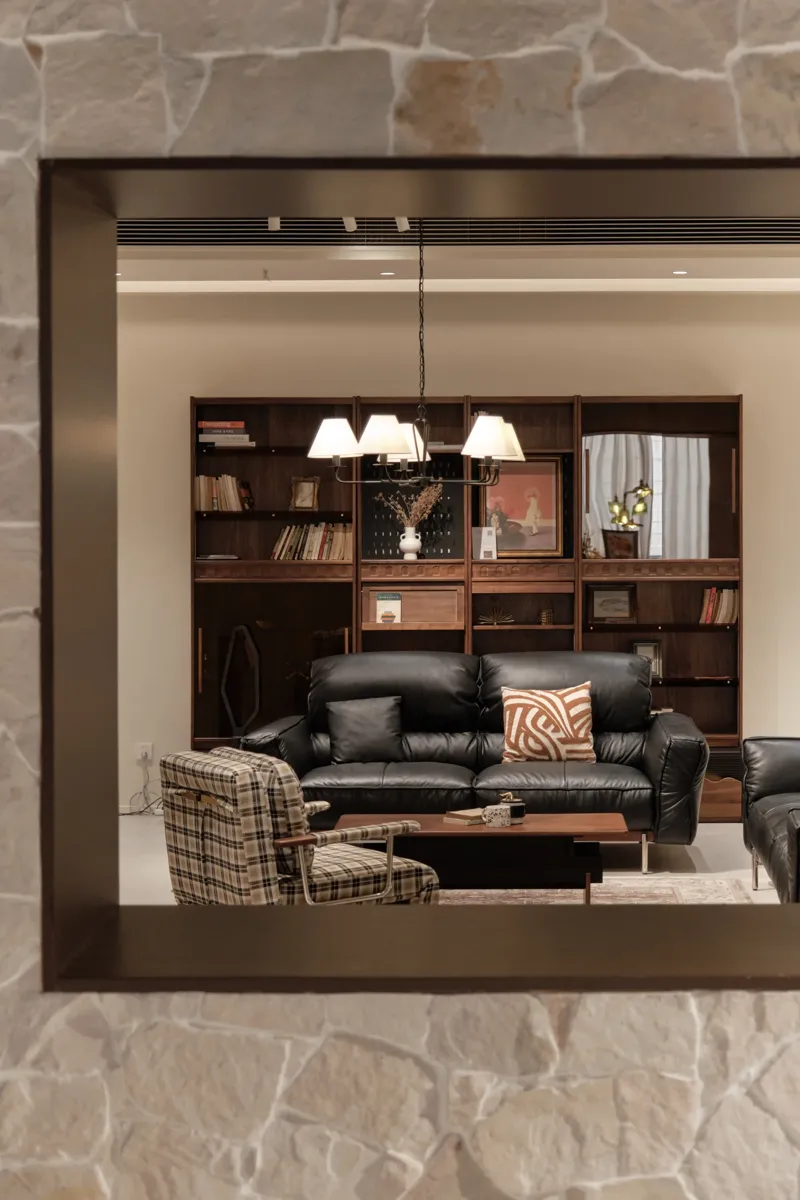 Another room set in the same showroom, which a second visitor describes as a store for several furniture brands.
