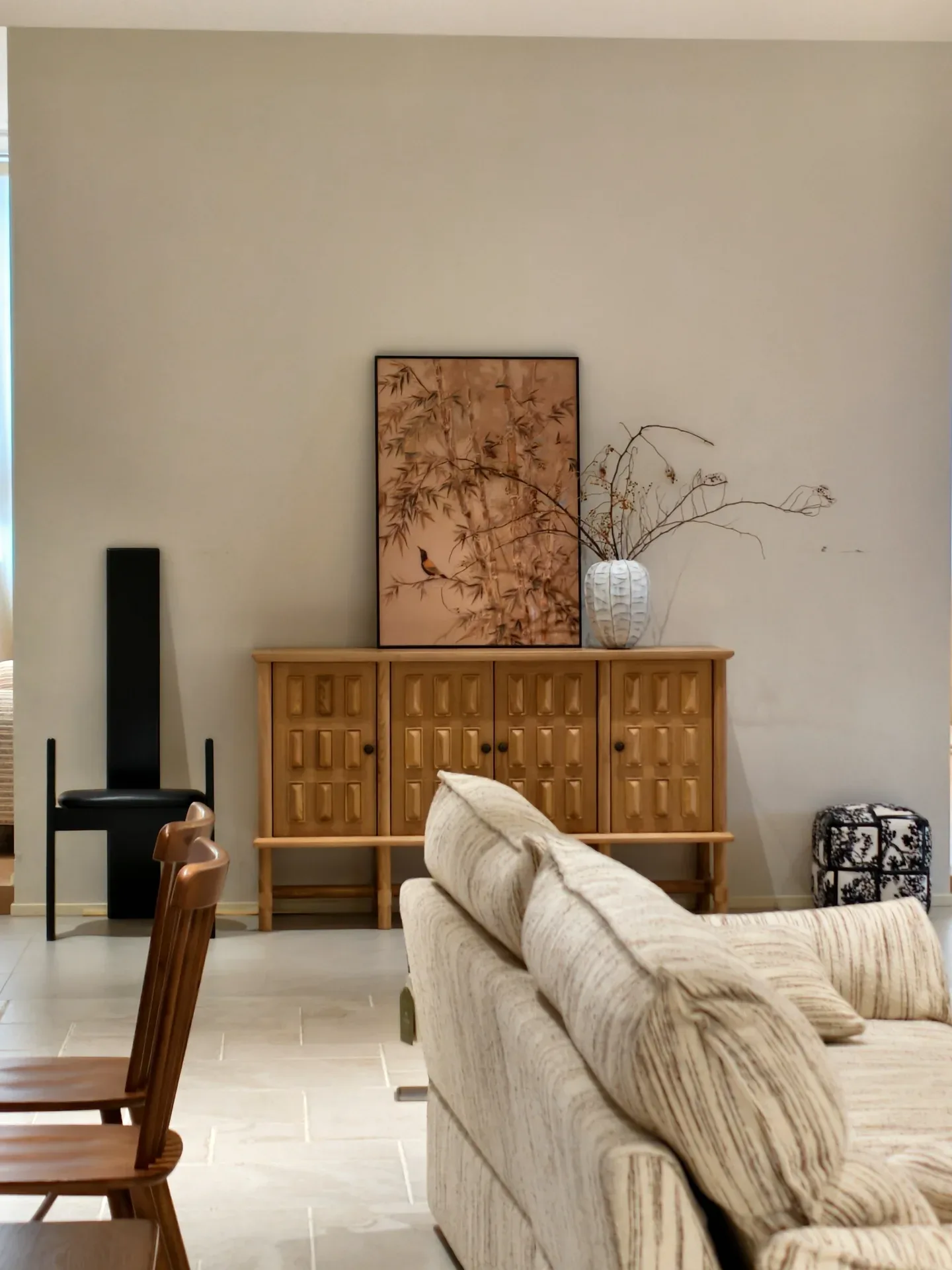 A carved-front sideboard and a high-back chair in the same showroom, as photographed by a visitor; ask for item codes, sizes and materials rather.